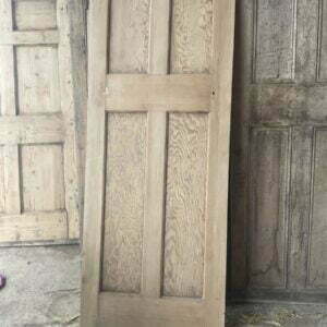 Reclaimed four panel door with larger lower panels