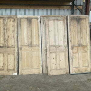 Assorted reclaimed four panel doors